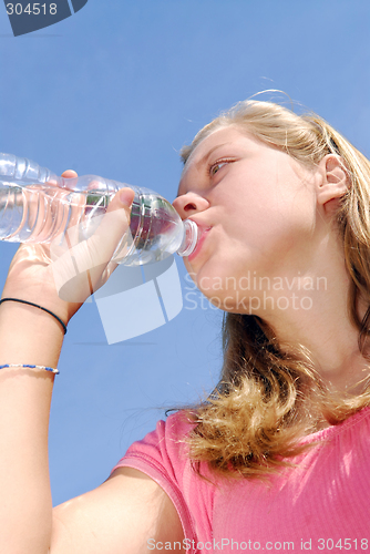 Image of Young girl drinking water