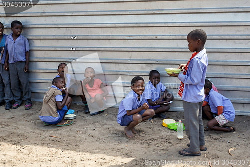 Image of Happy Namibian school children waiting for a lesson.