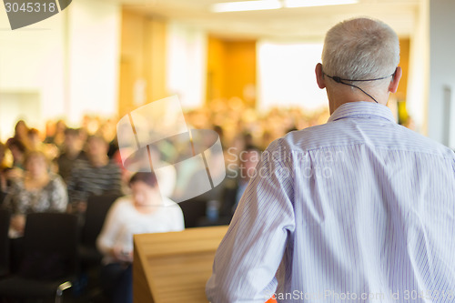 Image of Speaker at Business Conference and Presentation.