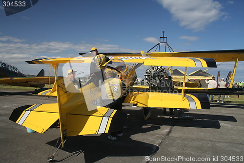 Image of Crew preparing stunt plane for performance