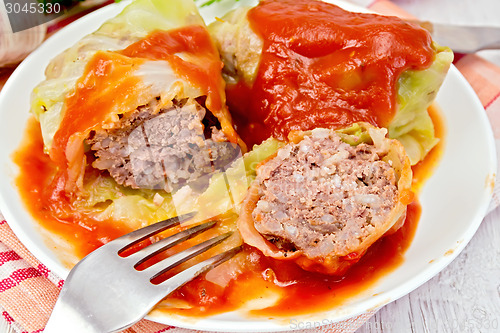 Image of Cabbage stuffed with tomato sauce on napkin