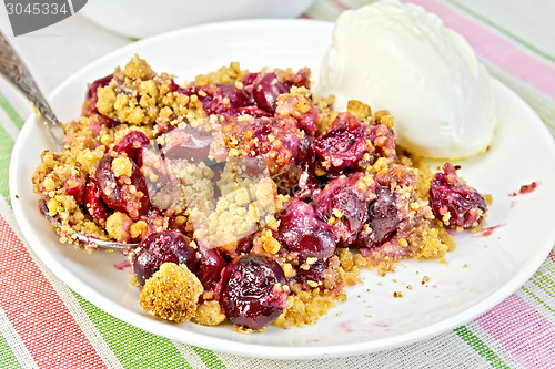 Image of Crumble cherry in plate on tablecloth