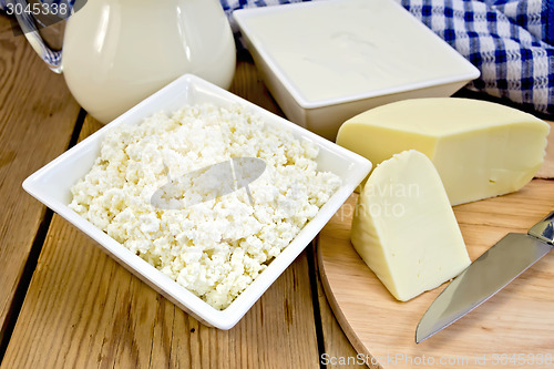 Image of Curd with cheese and napkin on board