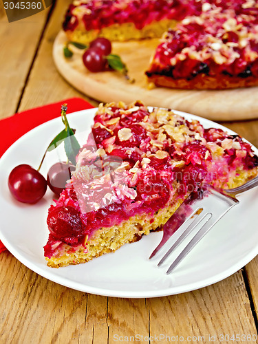 Image of Pie cherry with red napkin on board