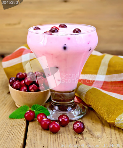 Image of Yogurt thick with cranberries and mint on board