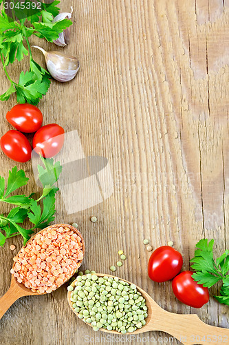 Image of Lentils in spoonful with vegetables on board frame