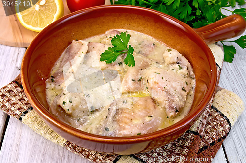 Image of Fish stew in sauce on ceramic pan