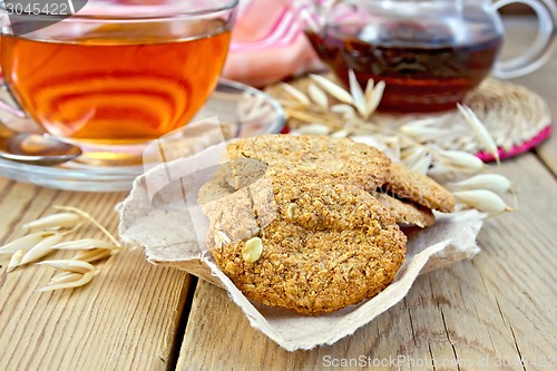 Image of Cookies oatmeal with spikelet and napkin on board