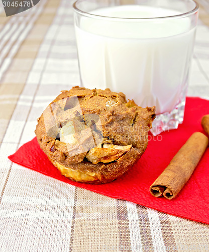 Image of Cupcake rye with apples on paper napkin with milk