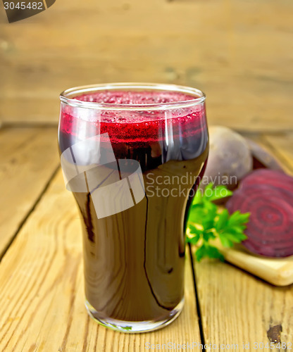 Image of Juice beet in tall glass on board