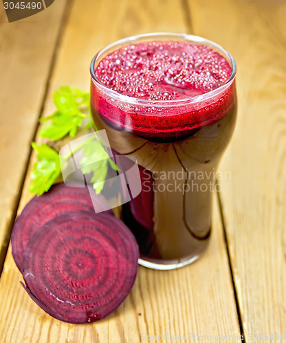 Image of Juice beet in glass on board