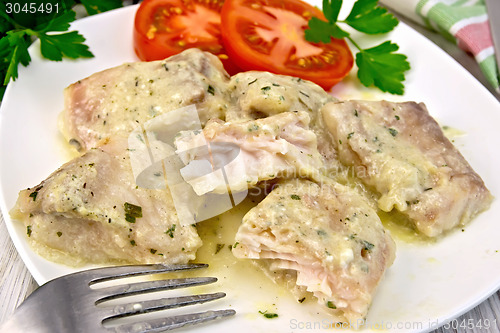 Image of Fish stew with cream sauce in plate on board