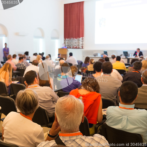 Image of Speaker at Business Conference and Presentation.