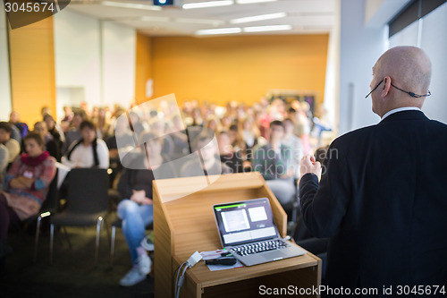 Image of Speaker at Business Conference and Presentation.