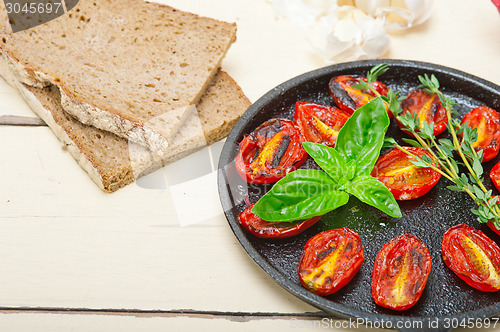 Image of baked cherry tomatoes with basil and thyme