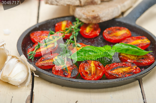 Image of baked cherry tomatoes with basil and thyme