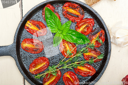 Image of baked cherry tomatoes with basil and thyme