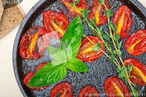 Image of baked cherry tomatoes with basil and thyme