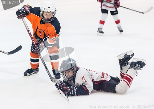 Image of Game between children ice-hockey teams