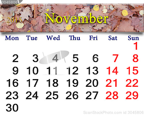 Image of calendar for November of 2015 with yellow leaves