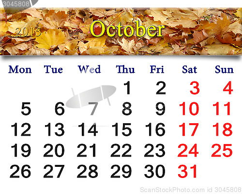 Image of calendar for October of 2015 with yellow leaves