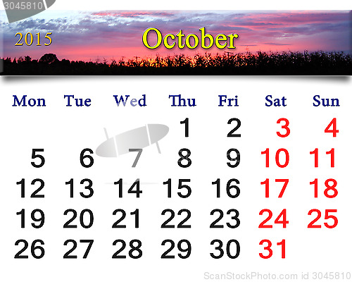 Image of calendar for October of 2015 with pink sunset