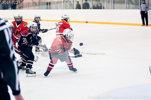 Image of Game moment of children ice-hockey teams