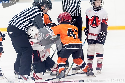 Image of Referee separates fighting players