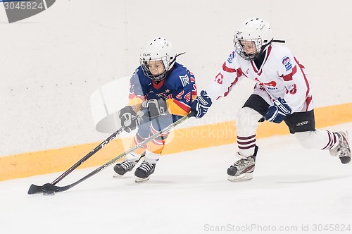 Image of Game between children ice-hockey teams