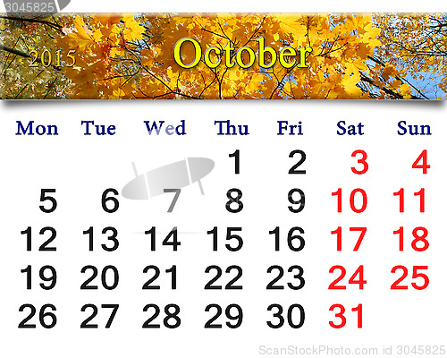 Image of calendar for October of 2015 with yellow leaves