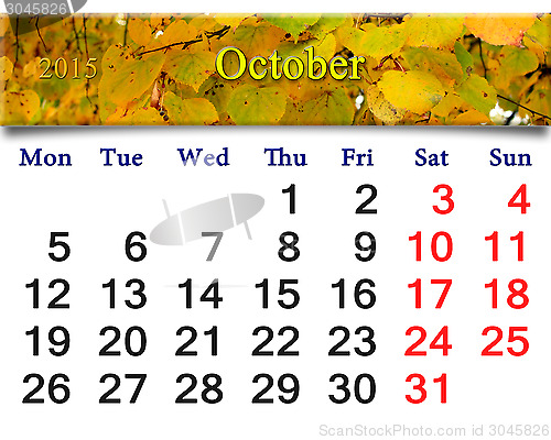 Image of calendar for October of 2015 with yellow leaves