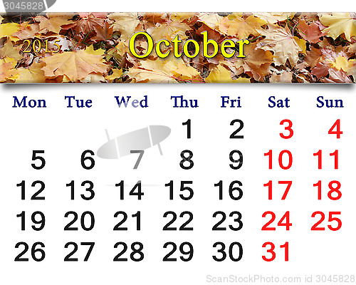 Image of calendar for October of 2015 with yellow leaves