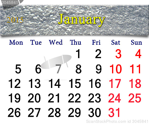 Image of calendar for January of 2015 with layer of snow