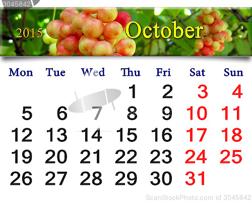 Image of calendar for October of 2015 with red schisandra