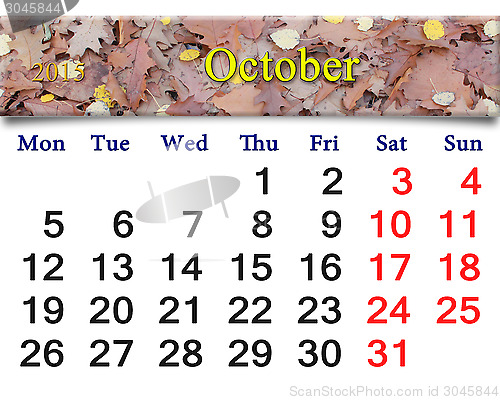 Image of calendar for October of 2015 with yellow leaves