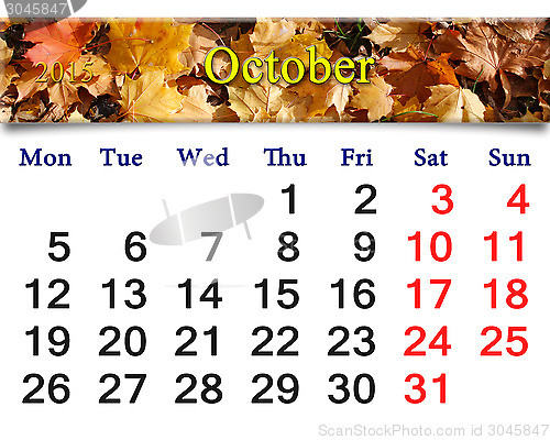 Image of calendar for October of 2015 with yellow leaves