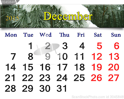 Image of calendar for December with evergreen spruce