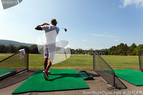 Image of Golfer at the Driving Range