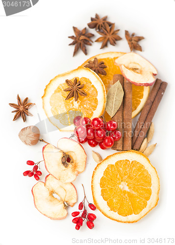 Image of Christmas spices and dried orange sliceson 