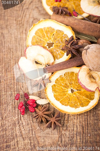 Image of Christmas spices and dried orange sliceson 