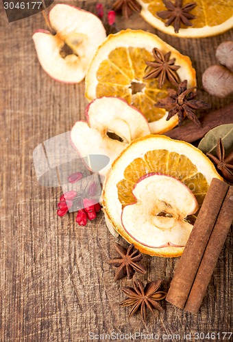 Image of Christmas spices and dried orange sliceson 