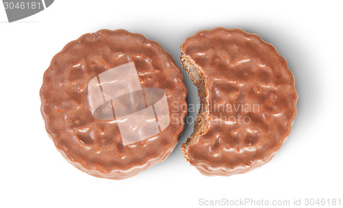 Image of Whole And Bitten Off Chocolate Cookies Lying Next