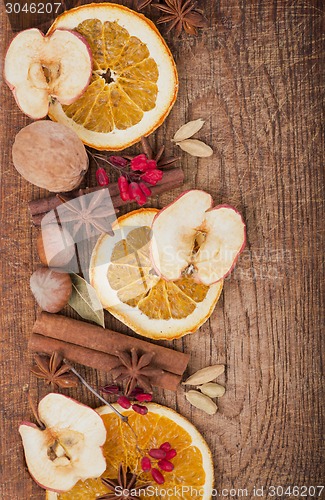 Image of Christmas spices and dried orange sliceson 