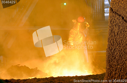 Image of worker in steel plant