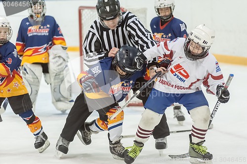 Image of Referee separates fighting players