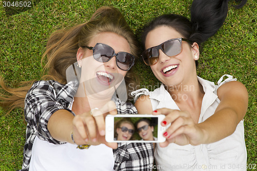 Image of Best friends taking selfies