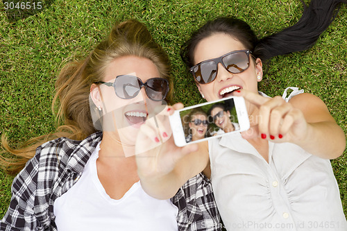 Image of Best friends taking selfies