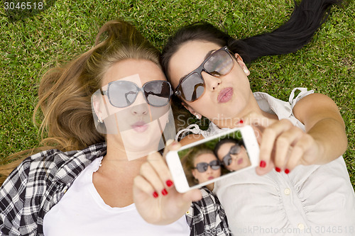 Image of Best friends taking selfies