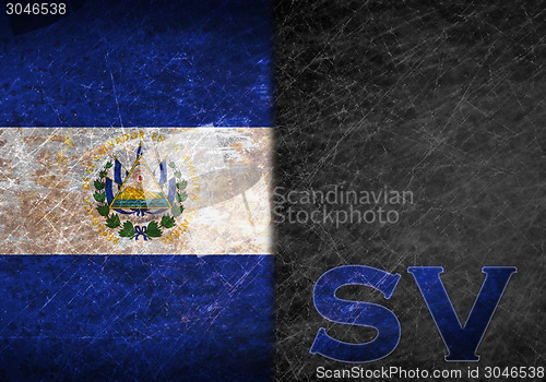 Image of Old rusty metal sign with a flag and country abbreviation