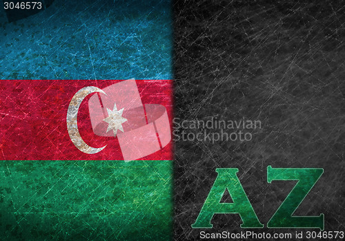 Image of Old rusty metal sign with a flag and country abbreviation